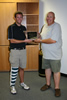 Newly elected Josh Berka presents Dave Huling with a plaque